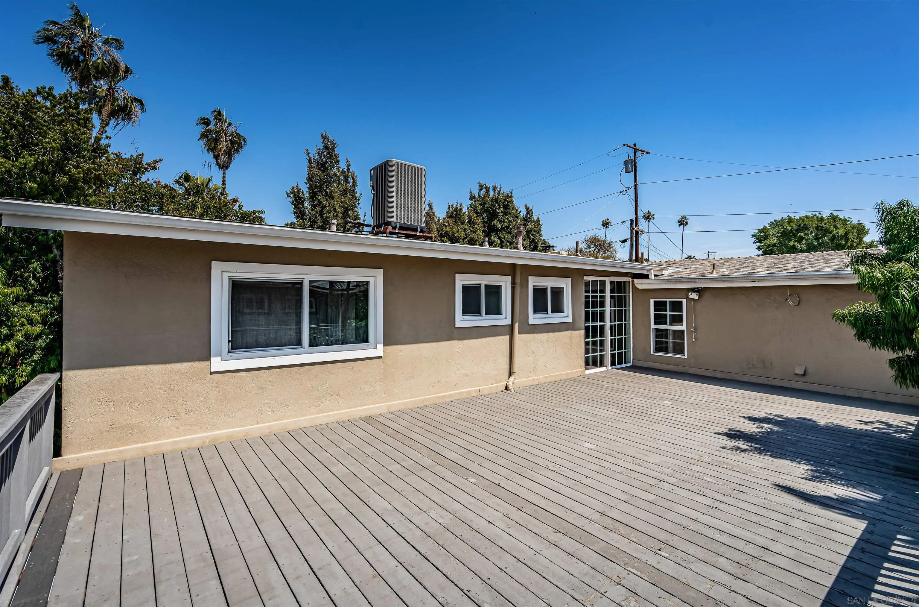 8410 Roy Street Lemon Grove, CA 91945 - Photo 18 of 40 a front view of a house with a garden