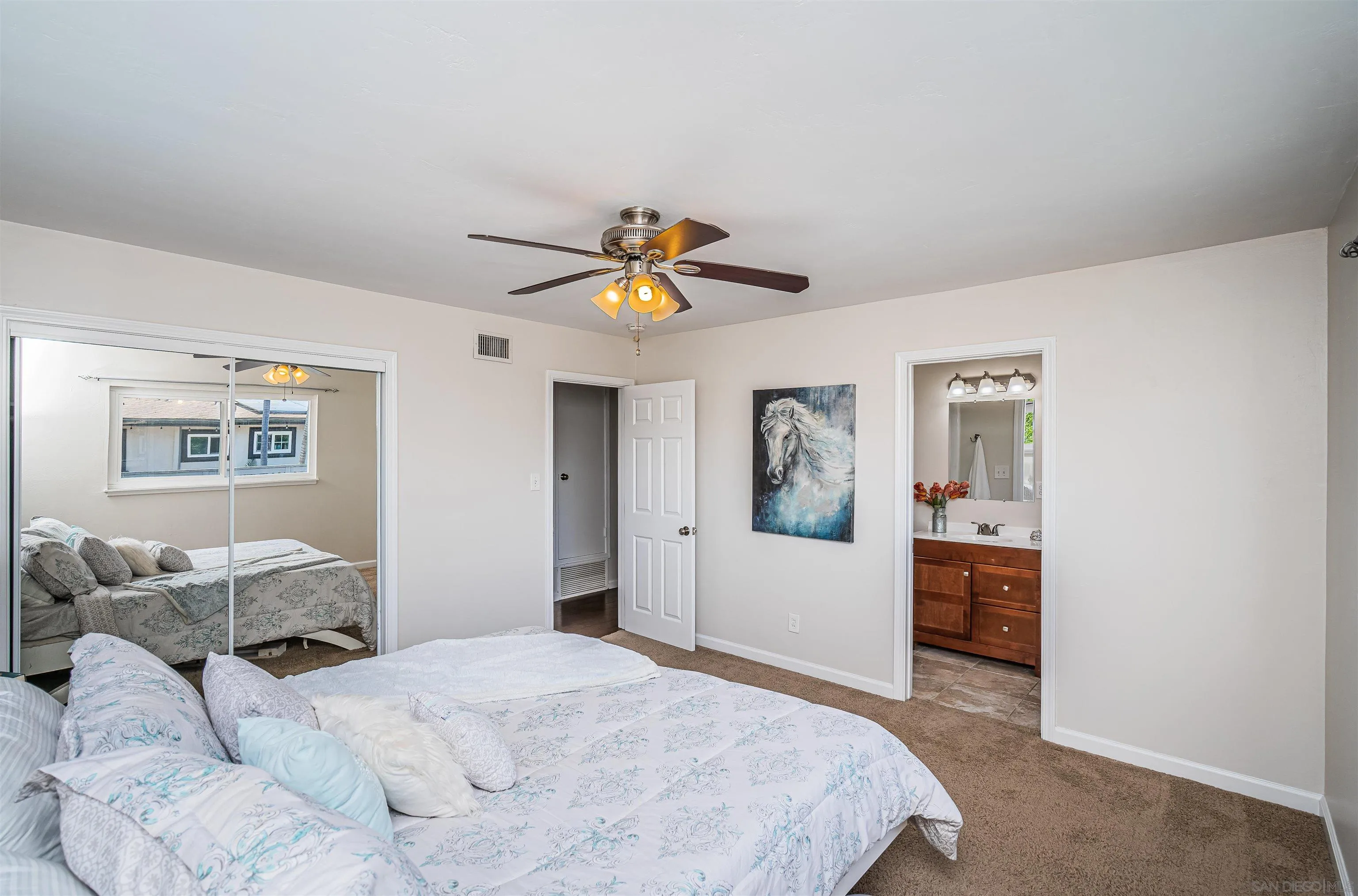 8410 Roy Street Lemon Grove, CA 91945 - Photo 20 of 40 a bedroom with a bed and a chandelier