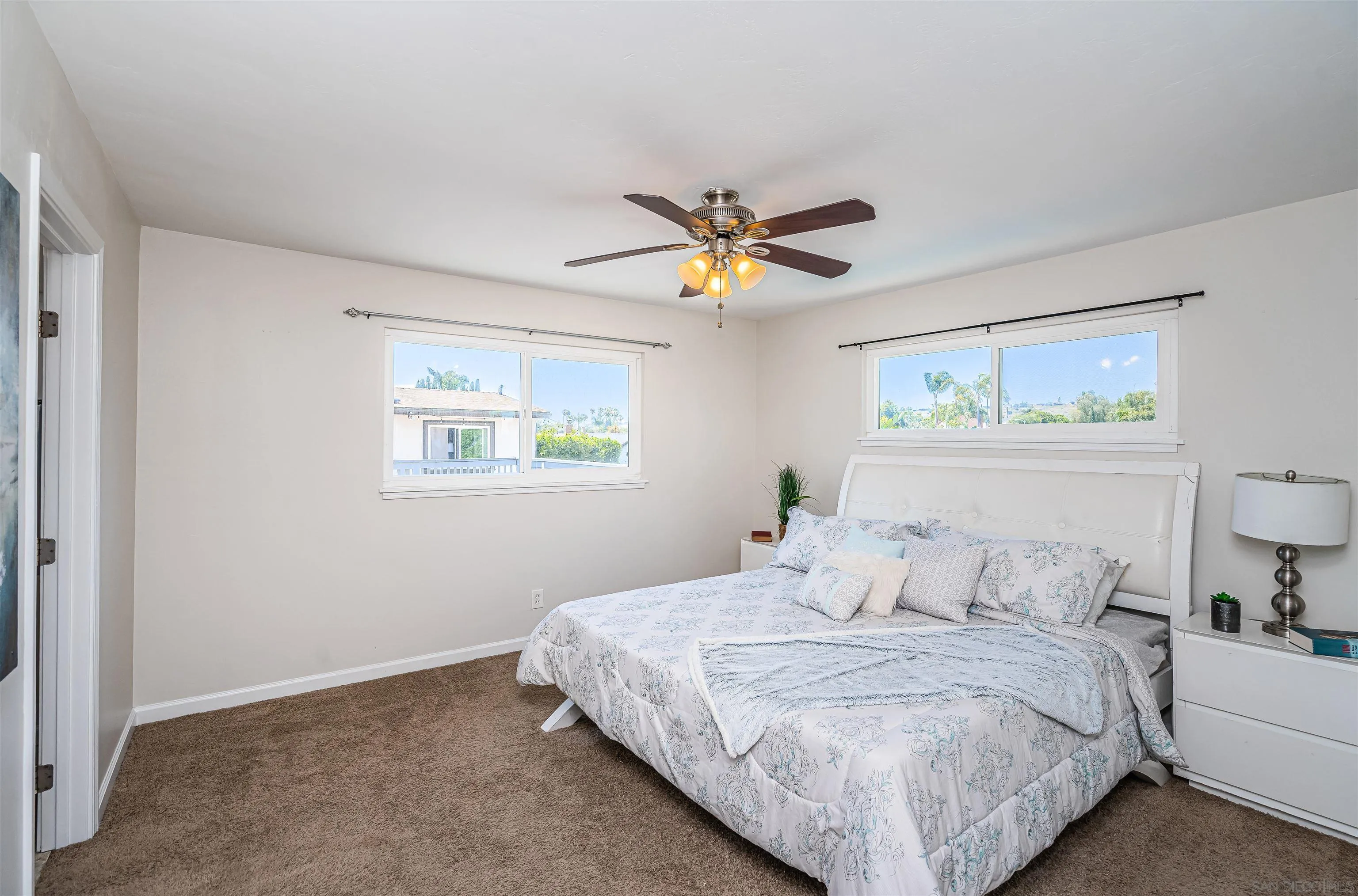 8410 Roy Street Lemon Grove, CA 91945 - Photo 21 of 40 a bedroom with a bed and a painting on the wall