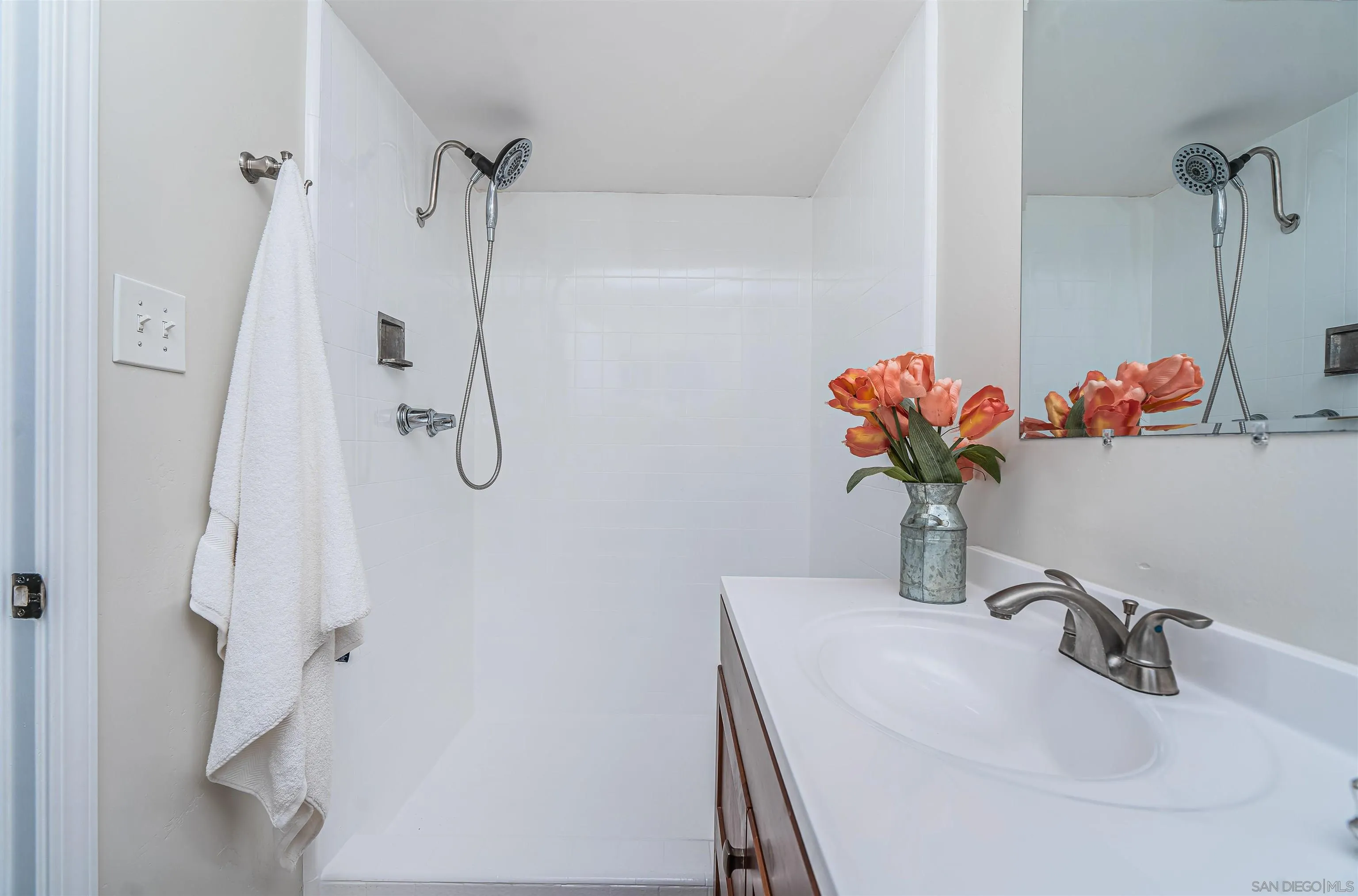 8410 Roy Street Lemon Grove, CA 91945 - Photo 27 of 40 a bathroom sink with a shower