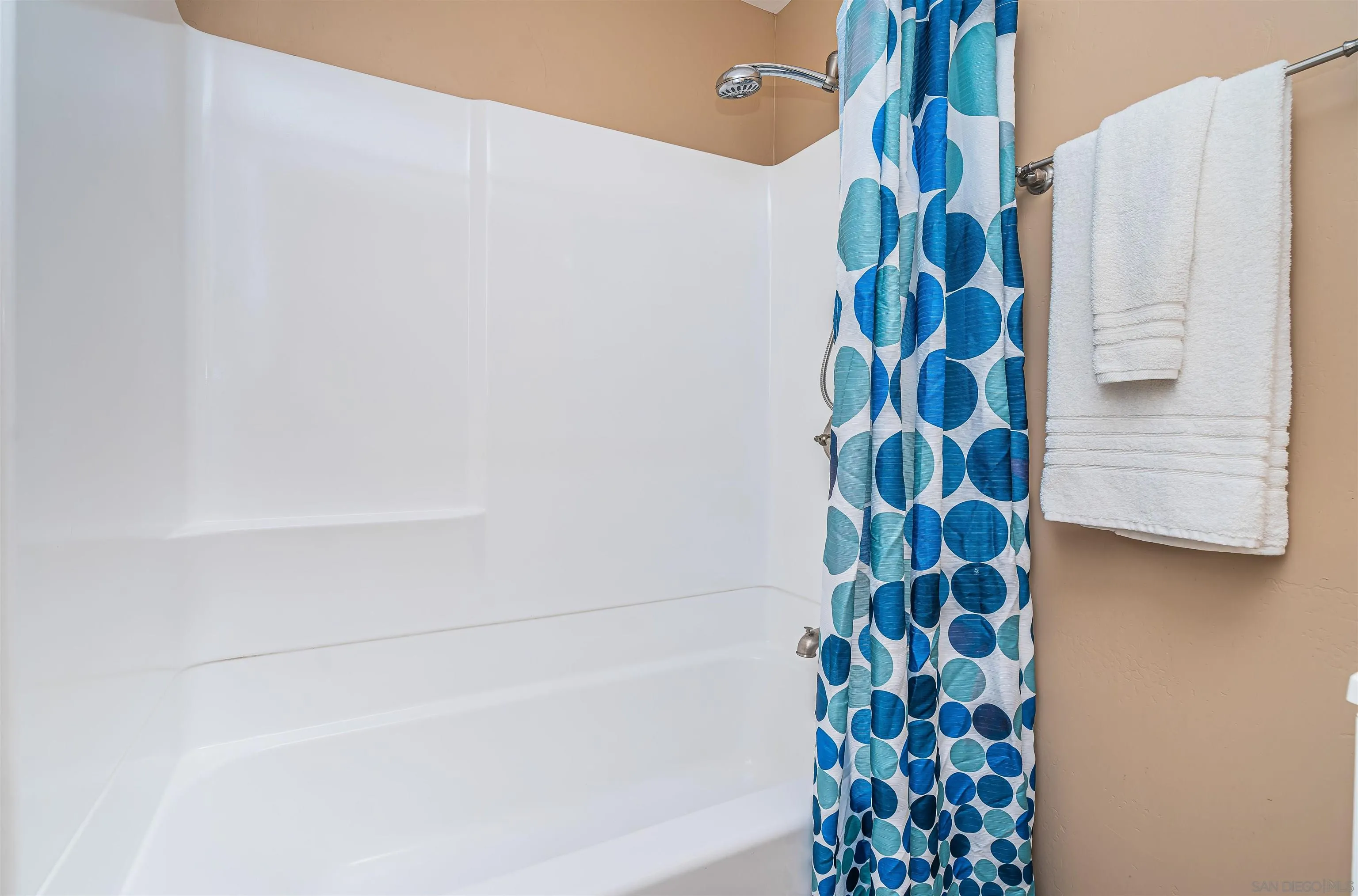 8410 Roy Street Lemon Grove, CA 91945 - Photo 33 of 40 a bathroom with a shower and a curtain