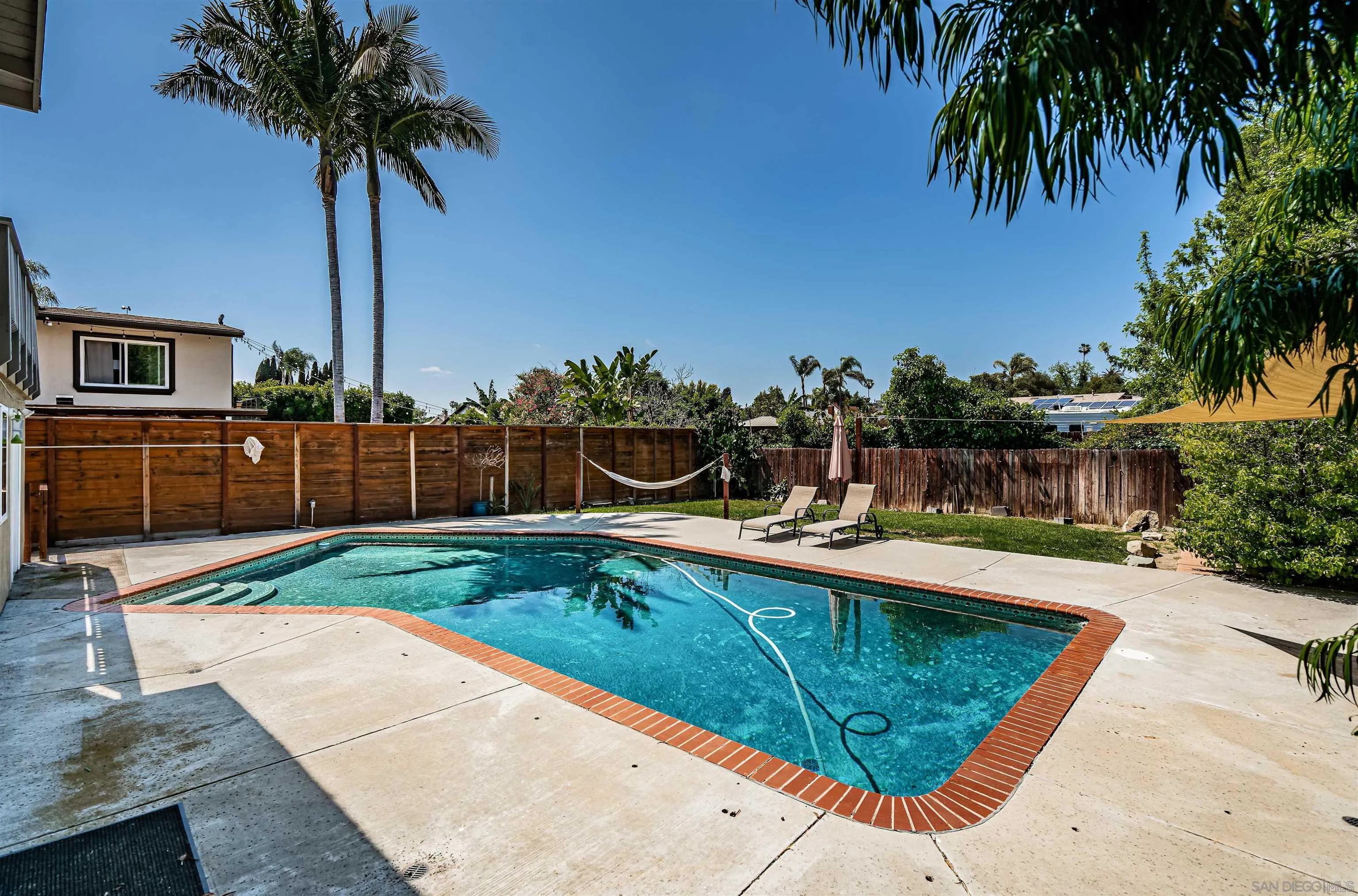8410 Roy Street Lemon Grove, CA 91945 - Photo 39 of 40 a view of a swimming pool with a garden