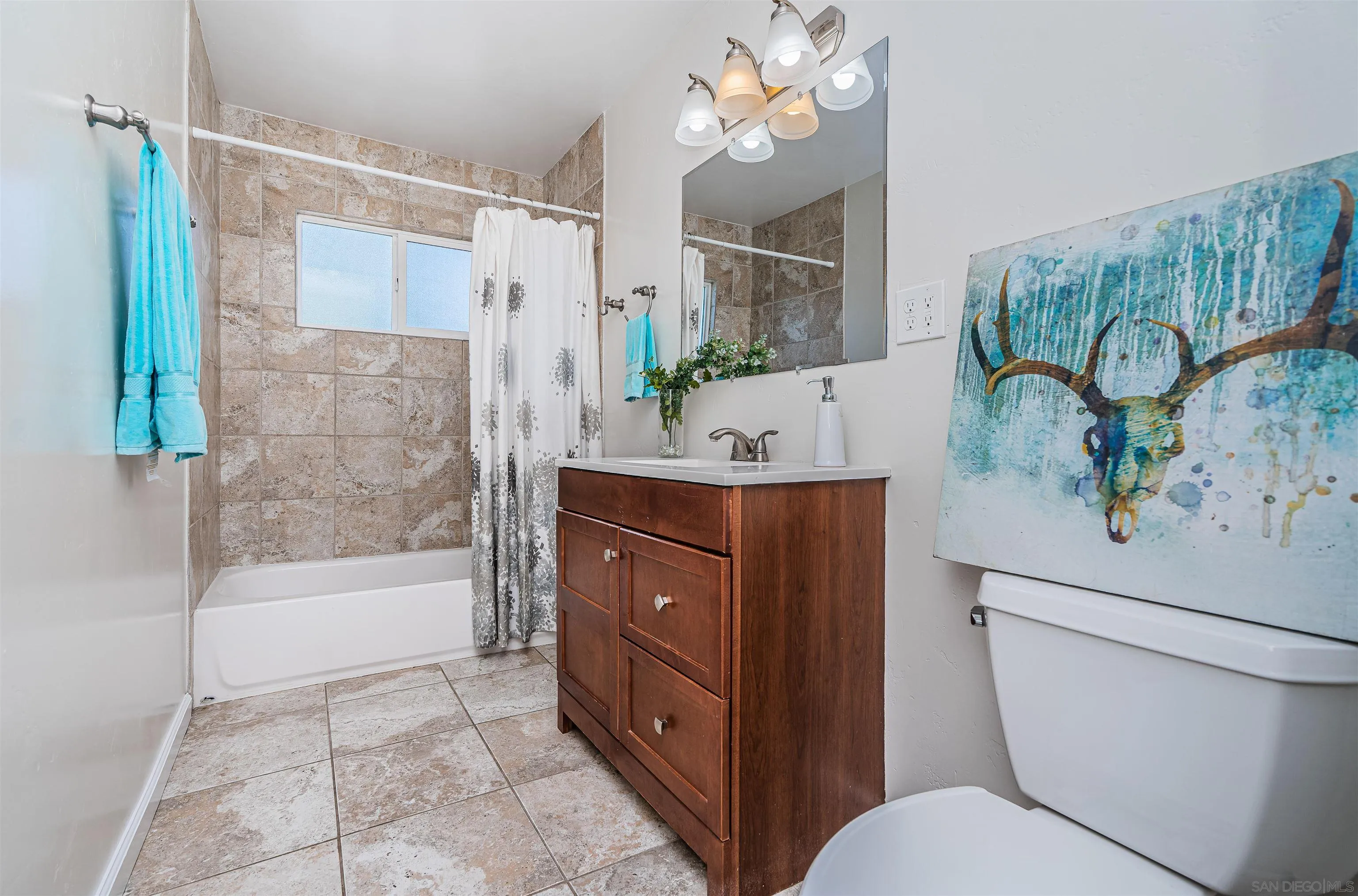 8410 Roy Street Lemon Grove, CA 91945 - Photo 5 of 40 a bathroom with a bathtub shower sink and mirror