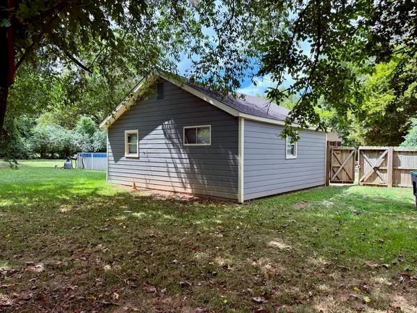 a house view with a garden space