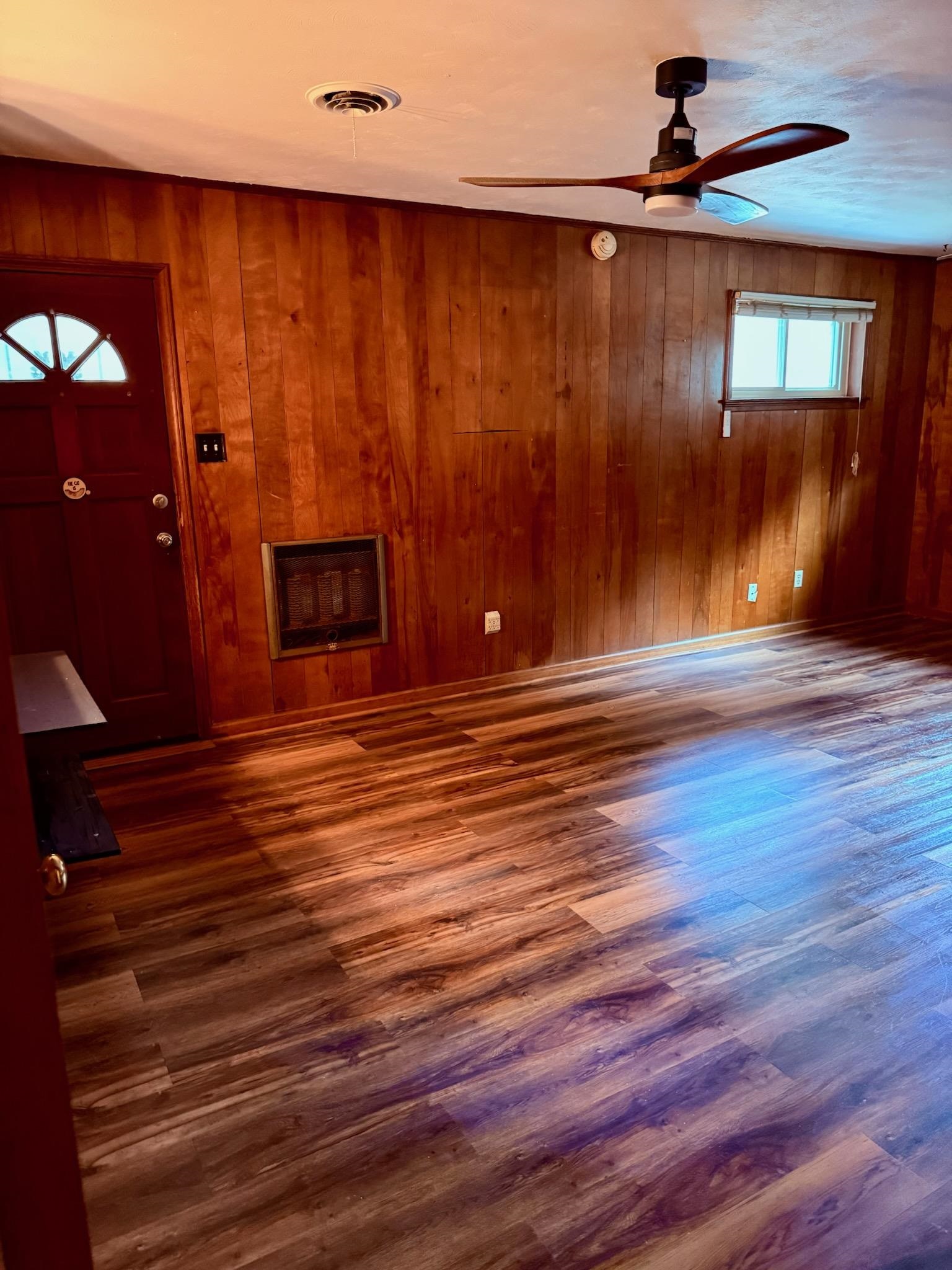 458 Gerald Road Memphis, TN 38122 - Photo 19 of 34 a view of room with wooden floor and a fireplace