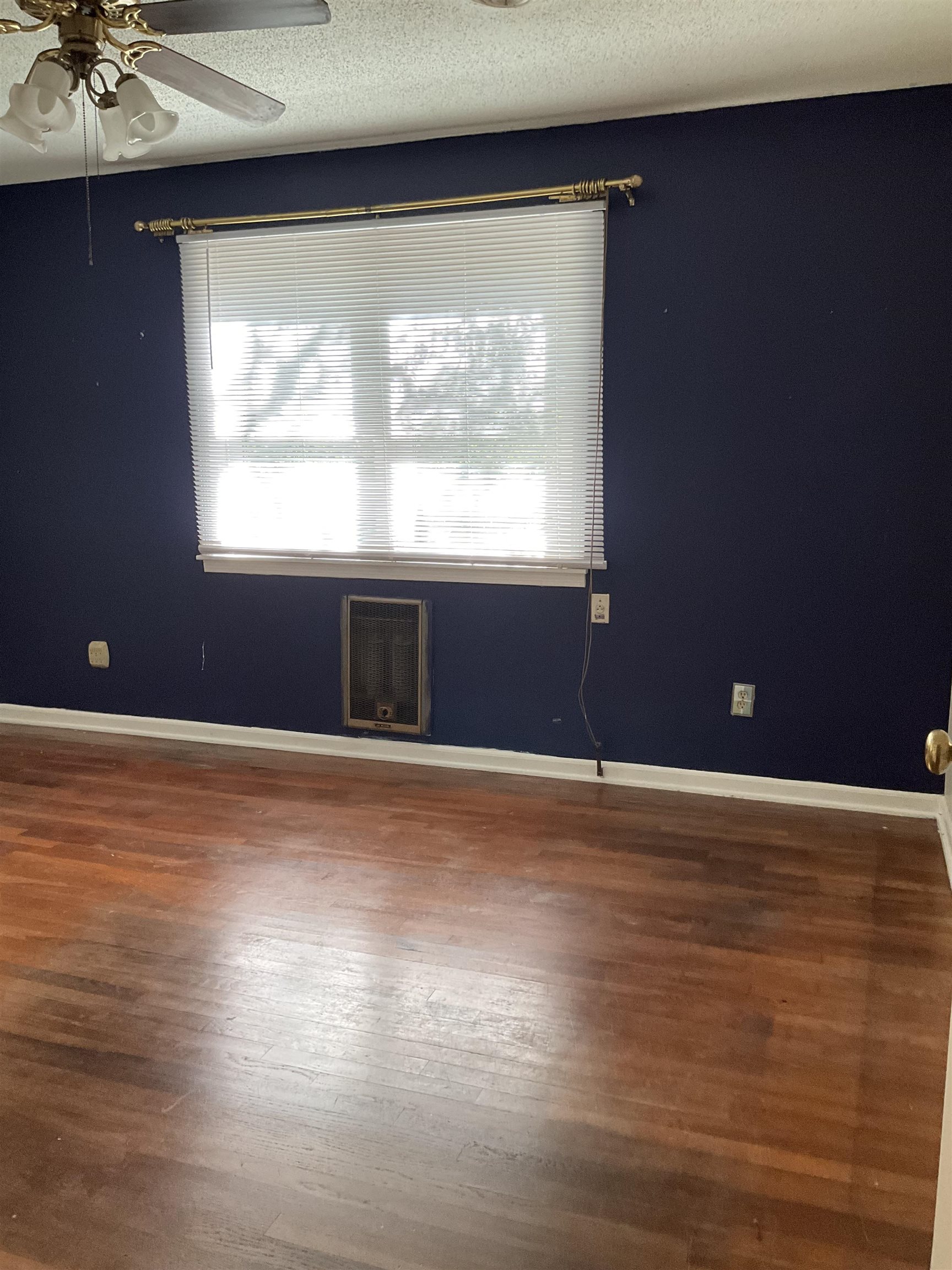 458 Gerald Road Memphis, TN 38122 - Photo 27 of 34 a view of an empty room with a window and wooden floor