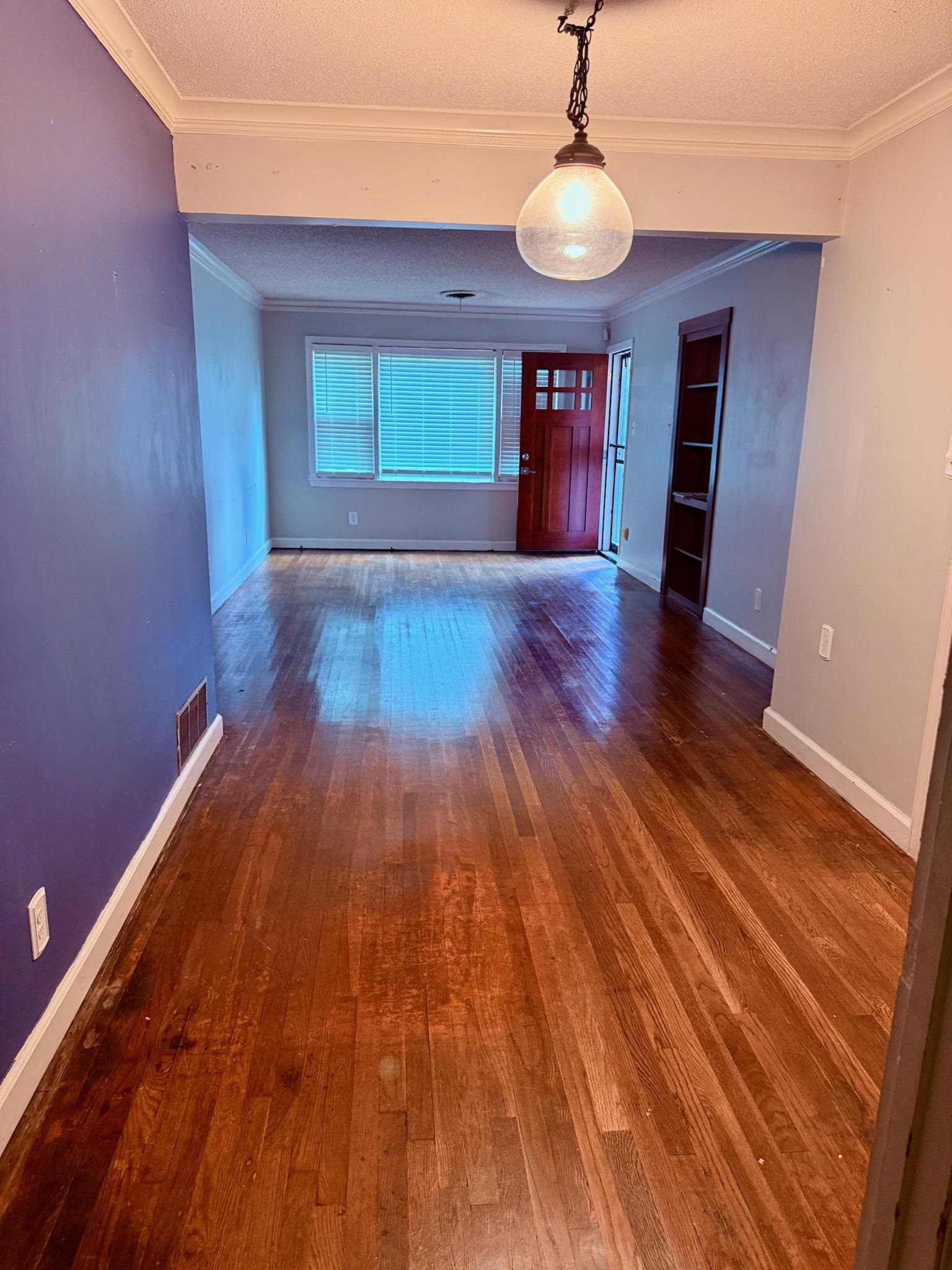 458 Gerald Road Memphis, TN 38122 - Photo 10 of 34 a empty room with wooden floor and ceiling fan