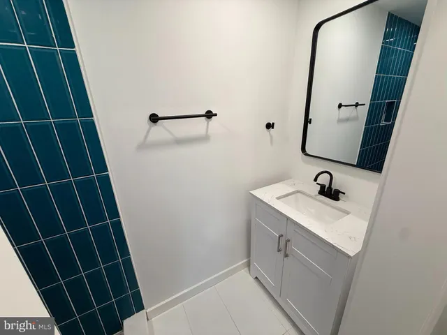 a bathroom with a sink and mirror