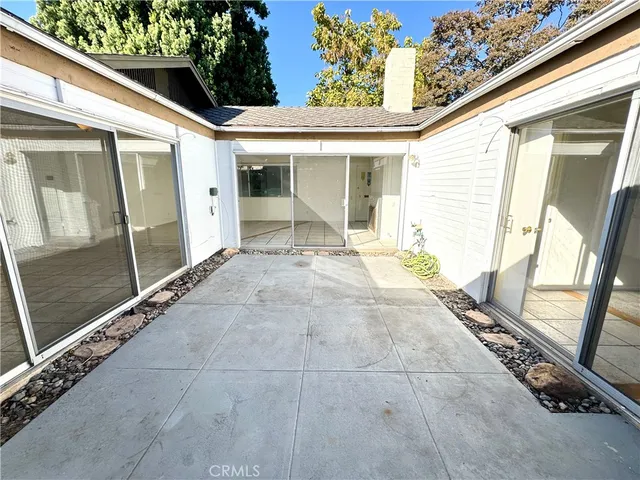 a view of a porch with wooden floor and stairs