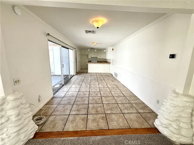 a view of a living room with a rug