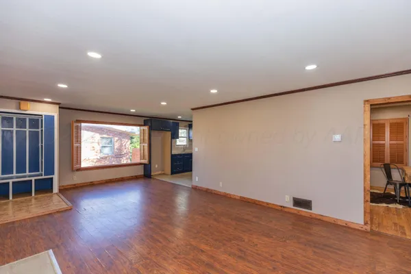 a workspace with furniture and wooden floor