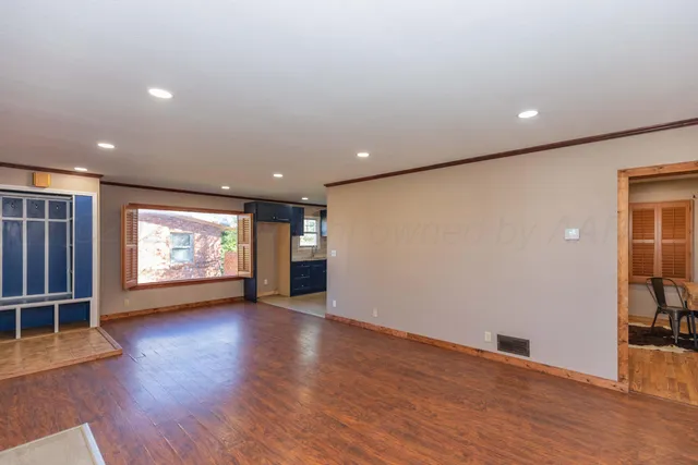 a workspace with furniture and wooden floor