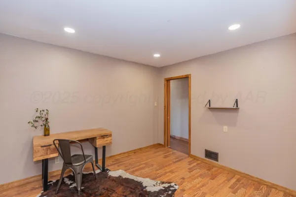 a view of hallway with wooden floor
