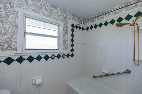 a bathroom with a sink vanity and a mirror