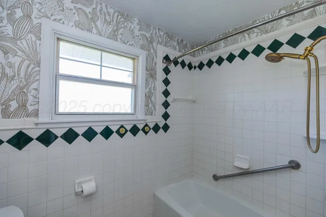 a bathroom with a sink vanity and a mirror