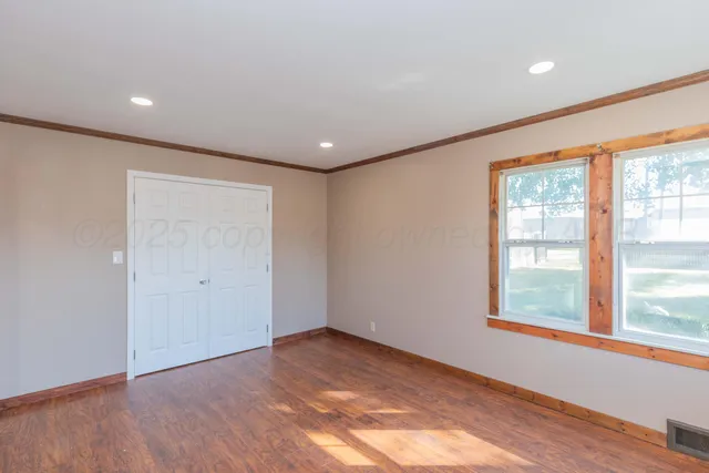 a view of an empty room with stairs