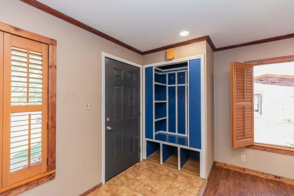 a kitchen with granite countertop wooden cabinets a sink and dishwasher