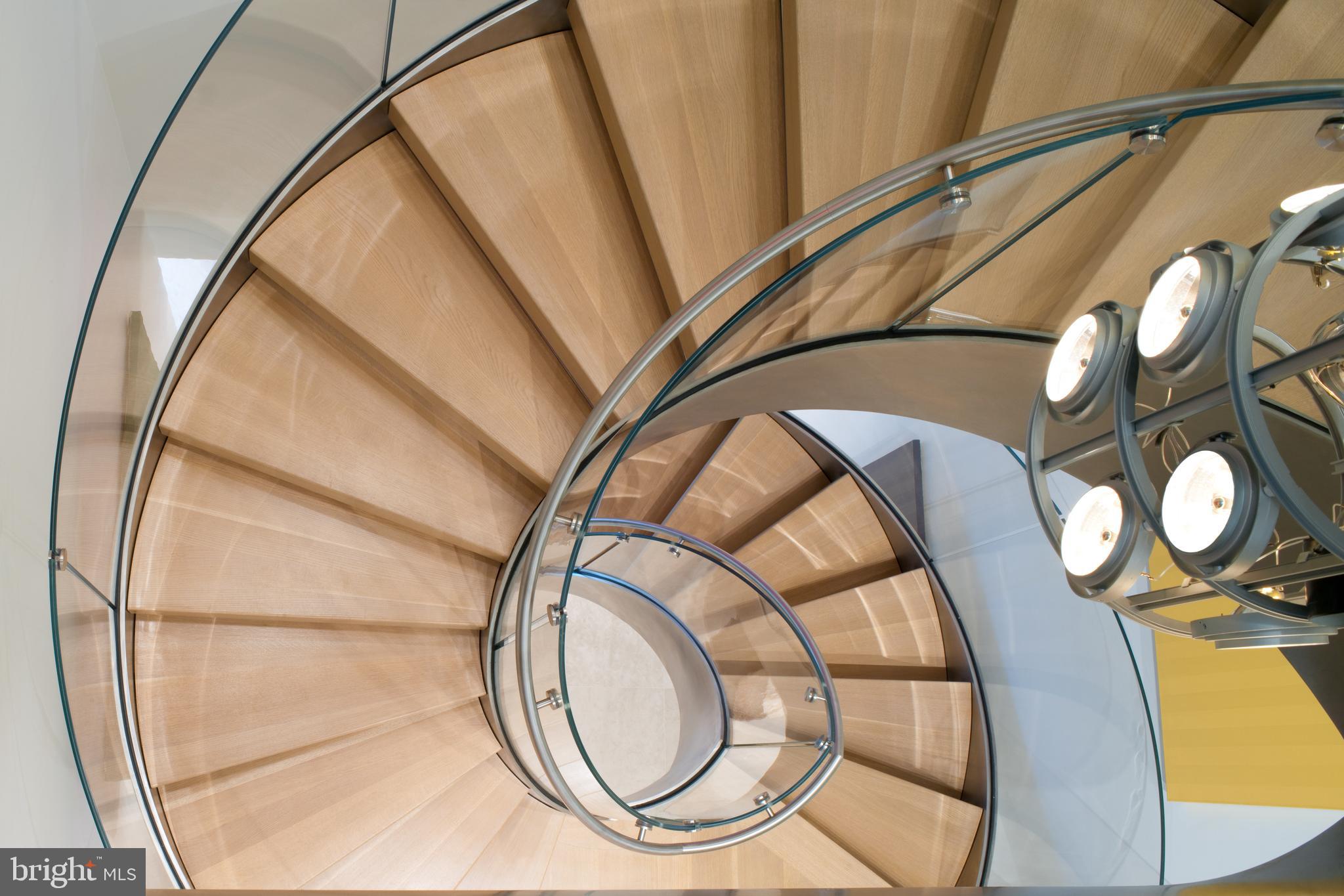 2438 Belmont Road Northwest Washington, DC 20008 - Photo 19 of 50 Custom glass staircase. Photo cred: Max Mackenzie