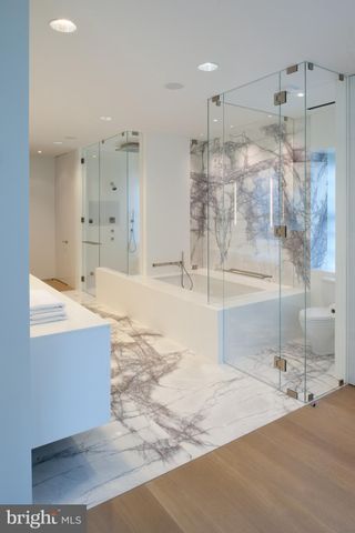 a large room with lots of counter space and windows