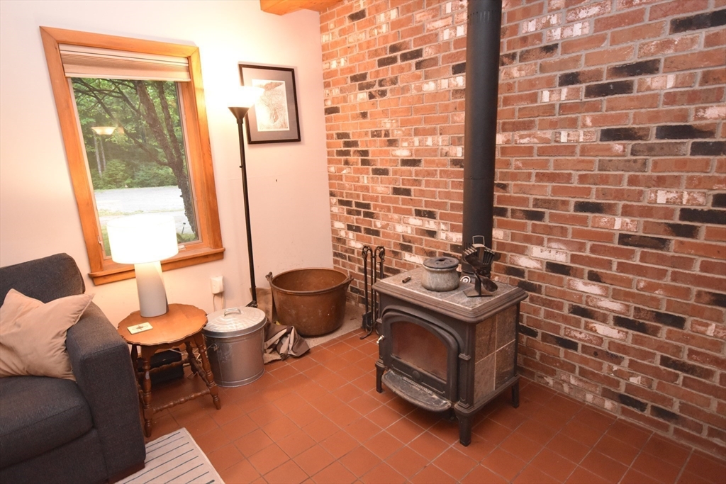 15 Number 6 Road Leverett, MA 01054 - Photo 8 of 40 a living room with a couch and a table