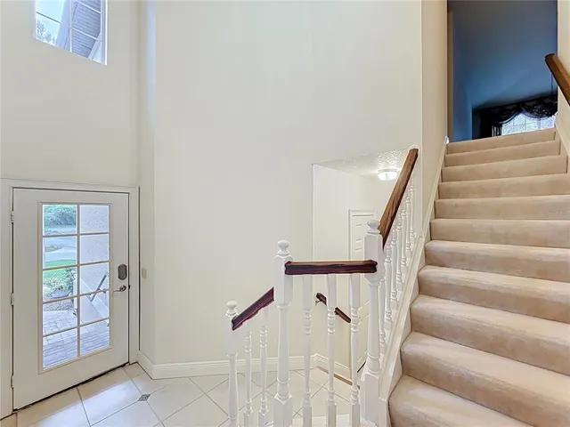 a view of a livingroom with a chandelier fan