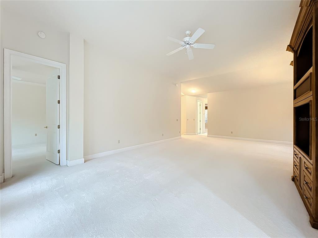 503 Camino Real, Unit 503 Howey-in-the-Hills, FL 34737 - Photo 17 of 65 an empty room with closet and a window