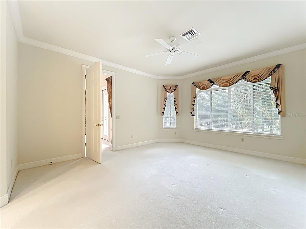 503 Camino Real, Unit 503 Howey-in-the-Hills, FL 34737 - Photo 25 of 65 a view of an empty room with a window