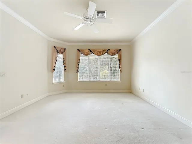 a spacious bathroom with a granite countertop sink mirror and shower