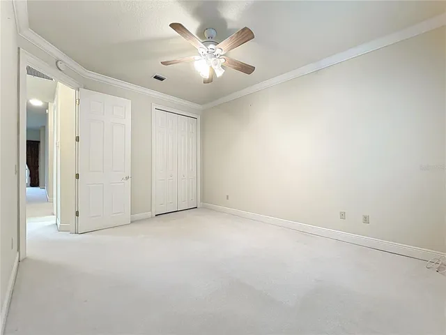 a bathroom with a sink a toilet and shower curtain