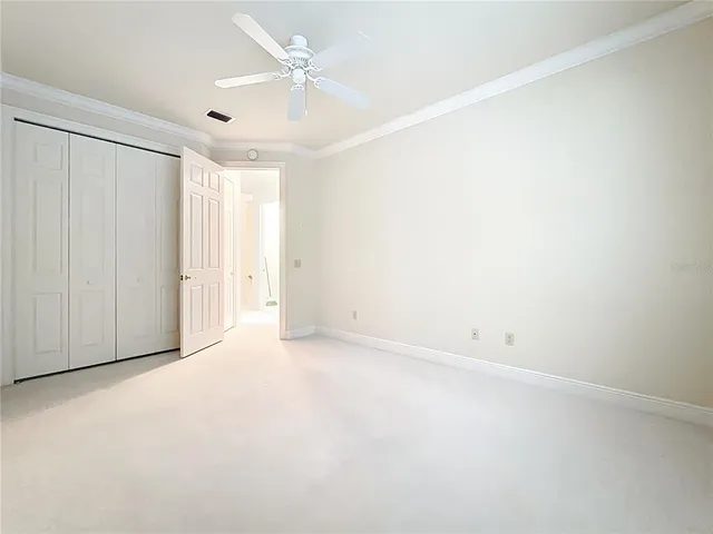 a view of an entryway with a ceiling fan