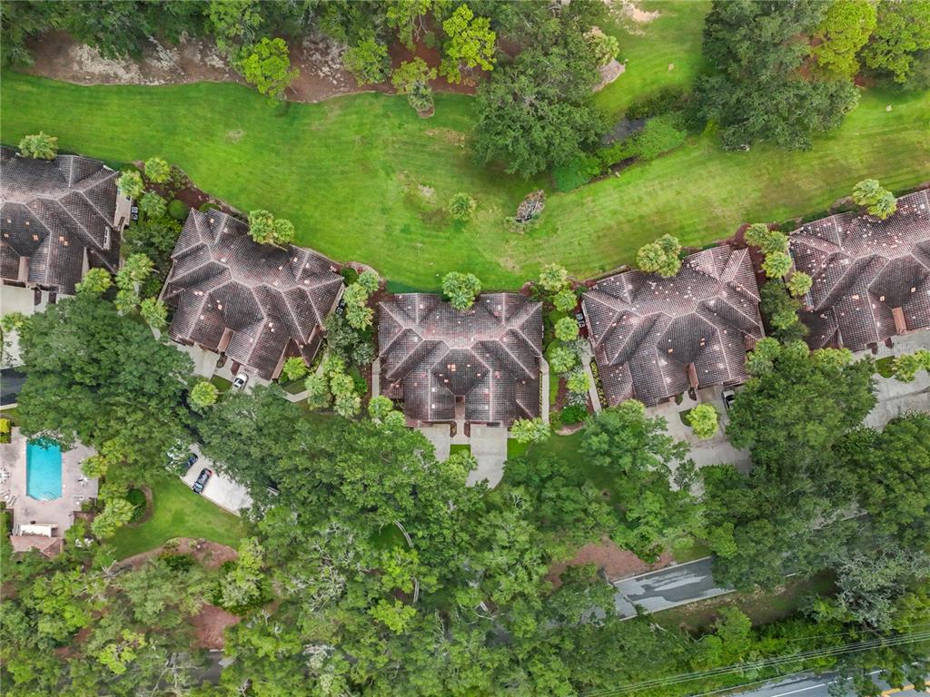 503 Camino Real, Unit 503 Howey-in-the-Hills, FL 34737 - Photo 53 of 65 an aerial view of house with outdoor space and lake view
