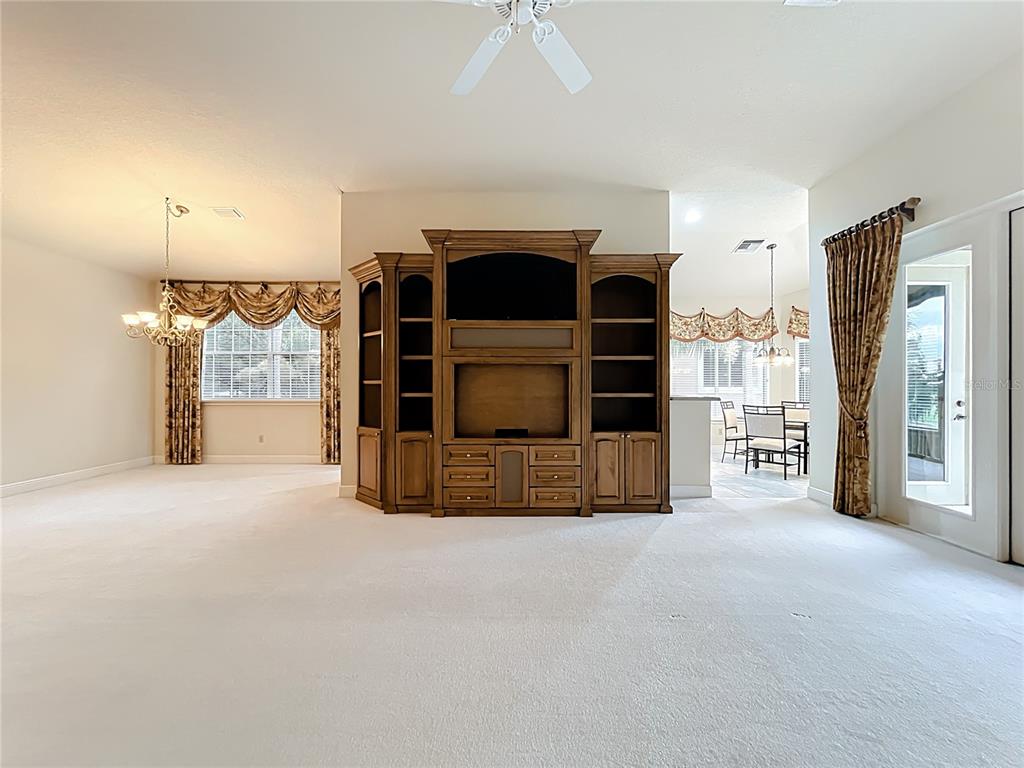 503 Camino Real, Unit 503 Howey-in-the-Hills, FL 34737 - Photo 6 of 65 a view of a livingroom with furniture and a fireplace