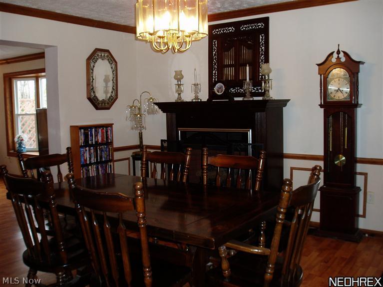 3877 South Ridge Road Perry, OH 44081 - Photo 8 of 25 With crown mouldings and custom wainscoting the 18' formal dining room has more than enough space for large gatherings.