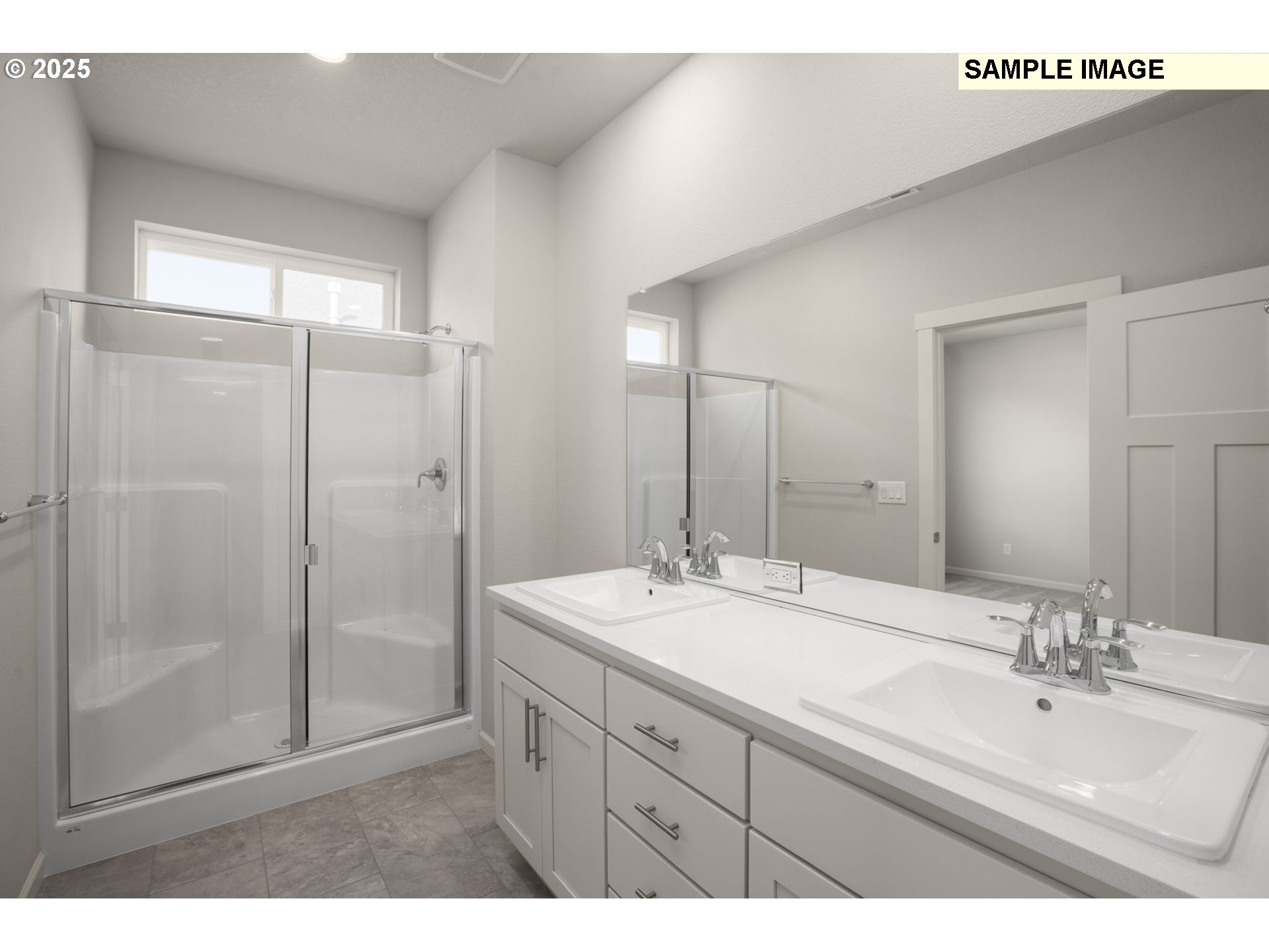 51096 Southwest Klompen Street, Unit H138 Scappoose, OR 97056 - Photo 25 of 30 a bathroom with a sink mirror and shower