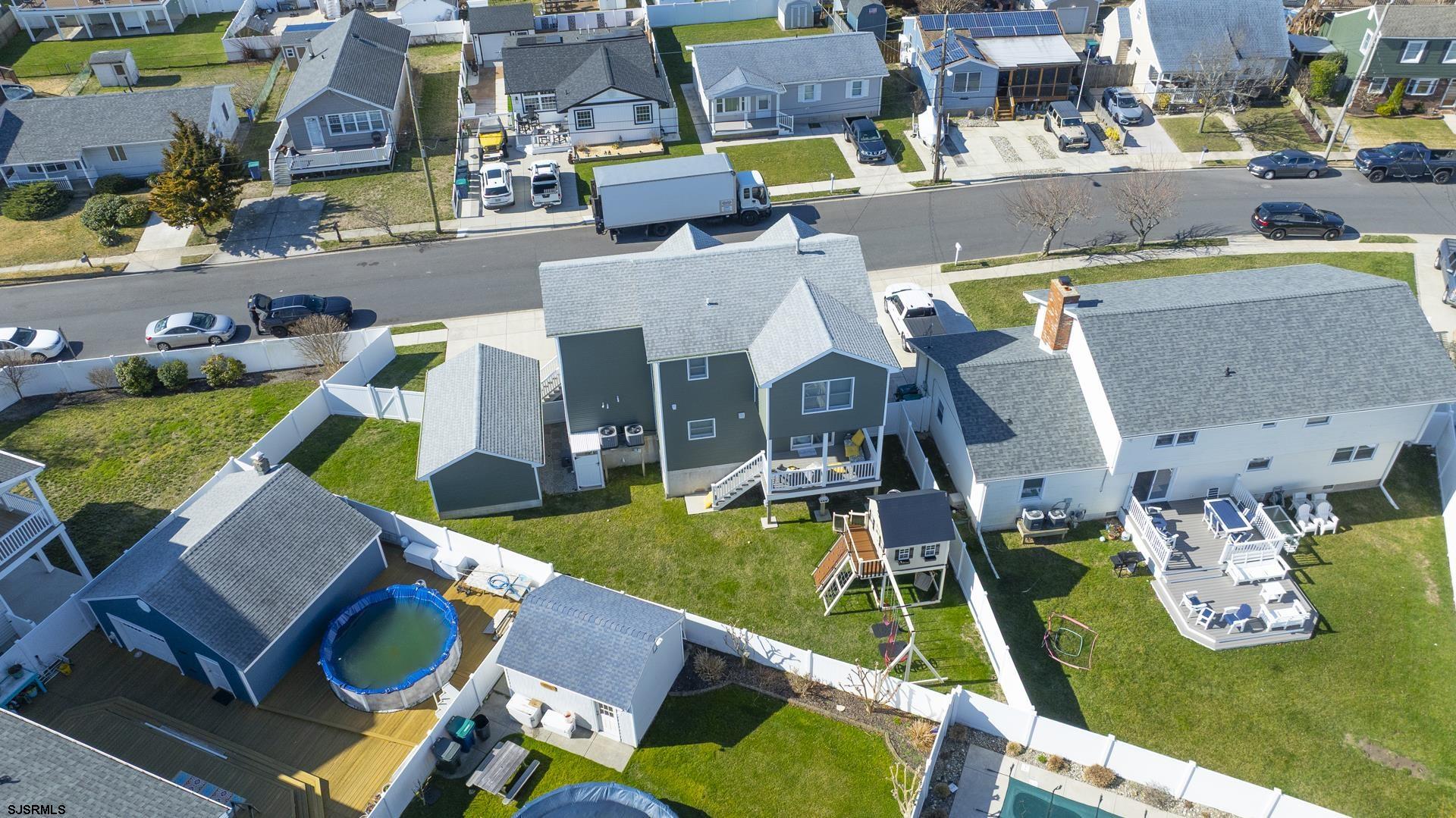 703 Bobby Jones Road Brigantine, NJ 08203 - Photo 31 of 34 an aerial view of a swimming pool with outdoor seating