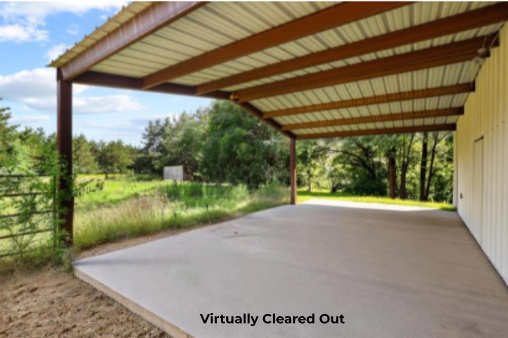 252 Meadow Lake Estates Road Denison, TX 75021 - Photo 4 of 37 Virtual cleared out shop with covered slab perfect for vehicles, toys and projects.