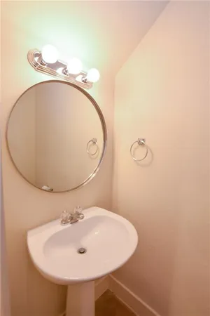 a bathroom with a sink and mirror