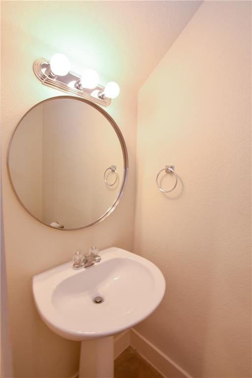 5405 Avenue H, Unit B Austin, TX 78751 - Photo 12 of 13 a bathroom with a sink and mirror
