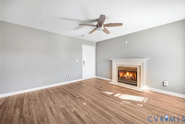 a view of an empty room and fire place