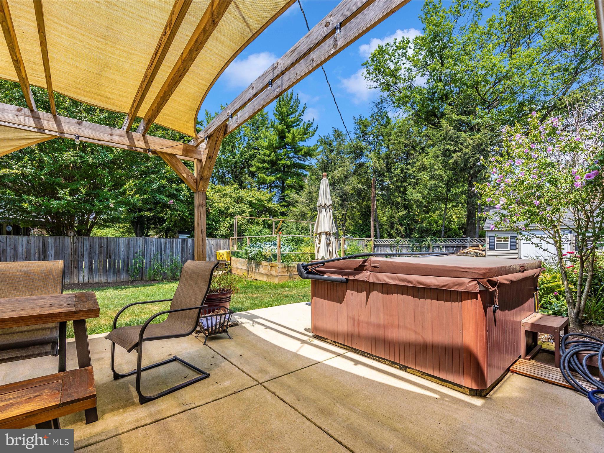 201 Crestview Court Frederick, MD 21702 - Photo 46 of 51 Patio, raised garden, hot tub and full fenced