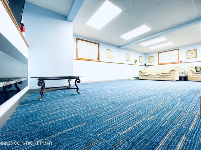 a view of a livingroom with wooden floor