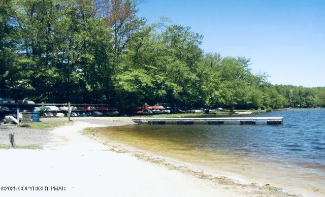 a view of a swimming pool with chairs