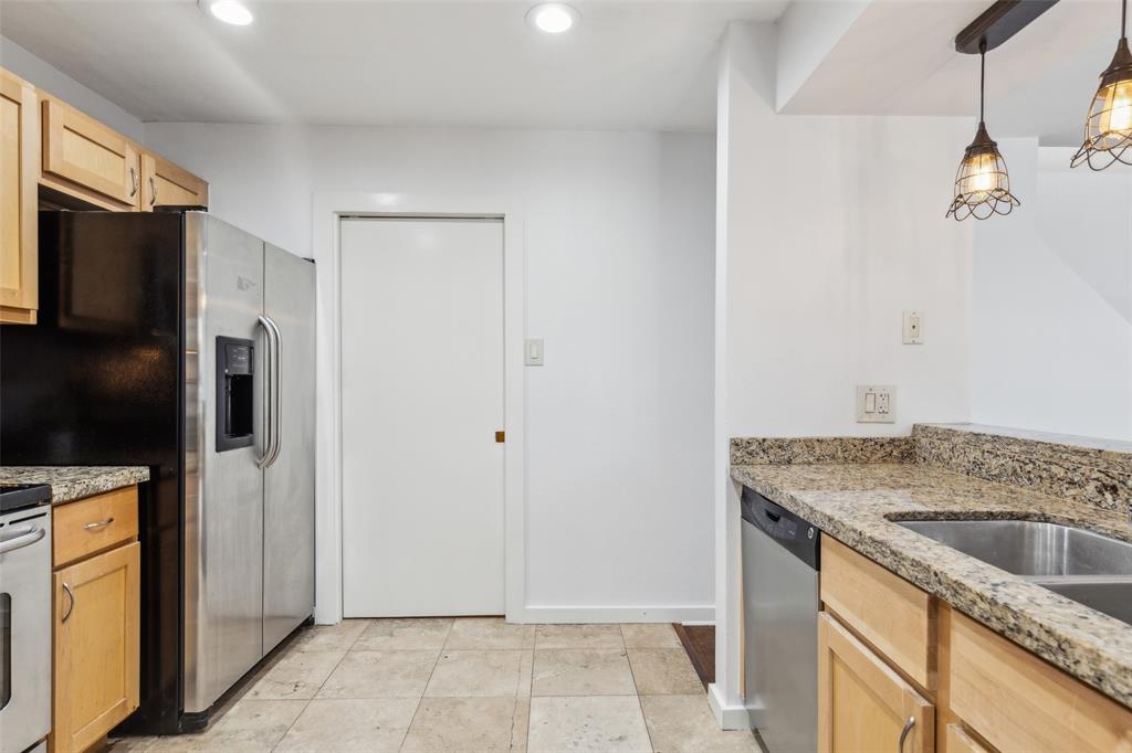 4777 Cedar Springs Road, Unit 6N Dallas, TX 75219 - Photo 8 of 26 a kitchen with a refrigerator a stove and a sink