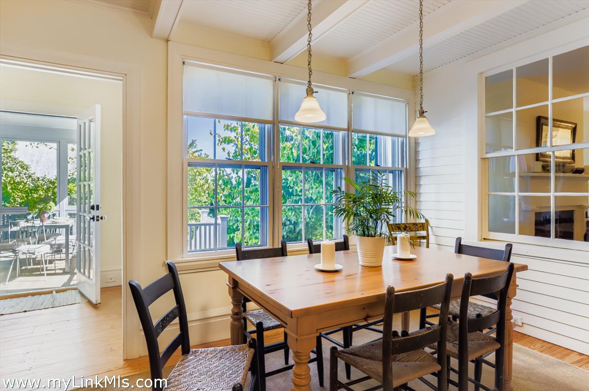 27 Spring Street Vineyard Haven, MA 02568 - Photo 11 of 58 a view of a dining room with furniture and window