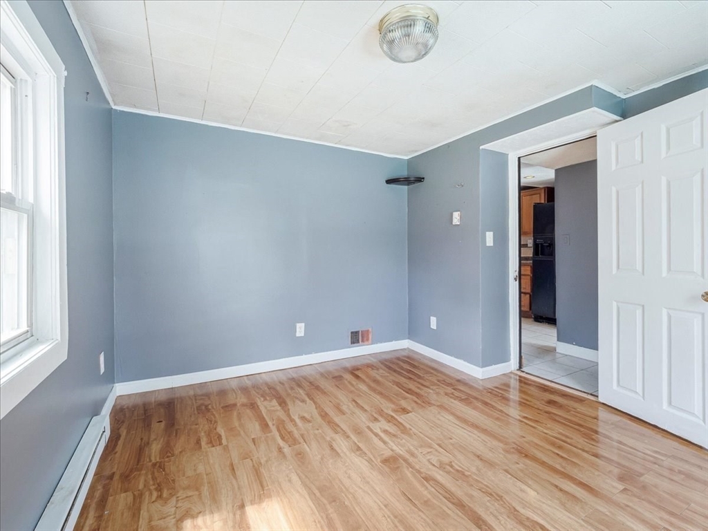 10 East Shore Road Holbrook, MA 02343 - Photo 16 of 30 an empty room with wooden floor and windows