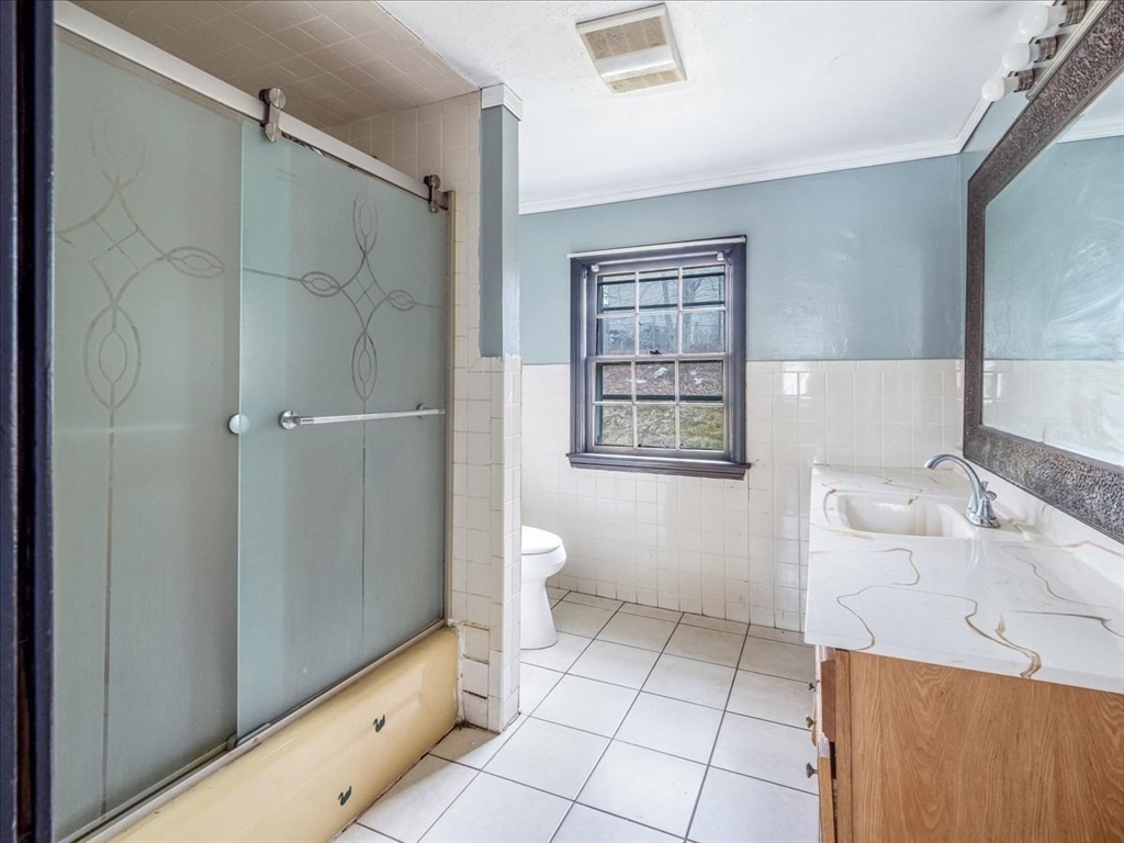 10 East Shore Road Holbrook, MA 02343 - Photo 18 of 30 a bathroom with a sink a toilet and shower