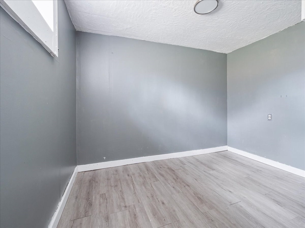 10 East Shore Road Holbrook, MA 02343 - Photo 27 of 30 a view of an empty room with wooden floor