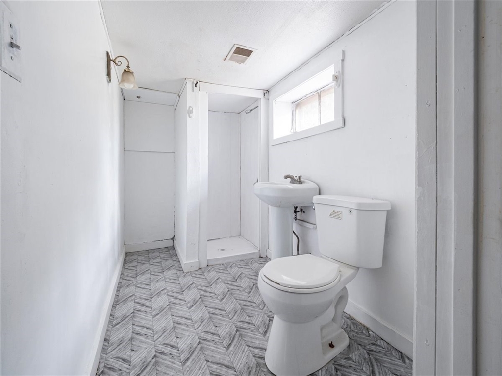 10 East Shore Road Holbrook, MA 02343 - Photo 28 of 30 a bathroom with a toilet and a shower
