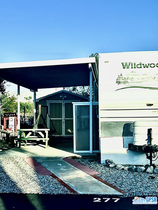 a view of swimming pool with outdoor seating