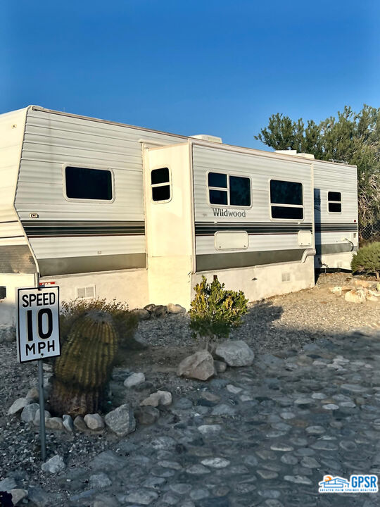 70201 Aurora Road Desert Hot Springs, CA 92241 - Photo 2 of 18 a view of a back yard of the house